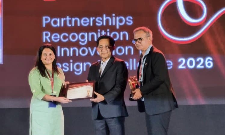 The Rathod team receiving the 2026 partnership award on stage