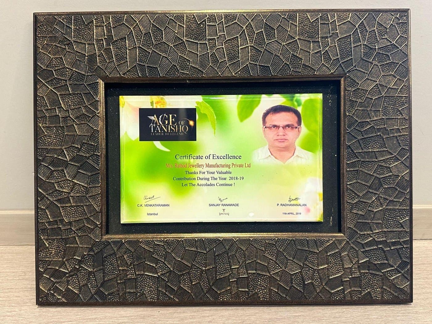 The framed Tanishq certificate of excellence